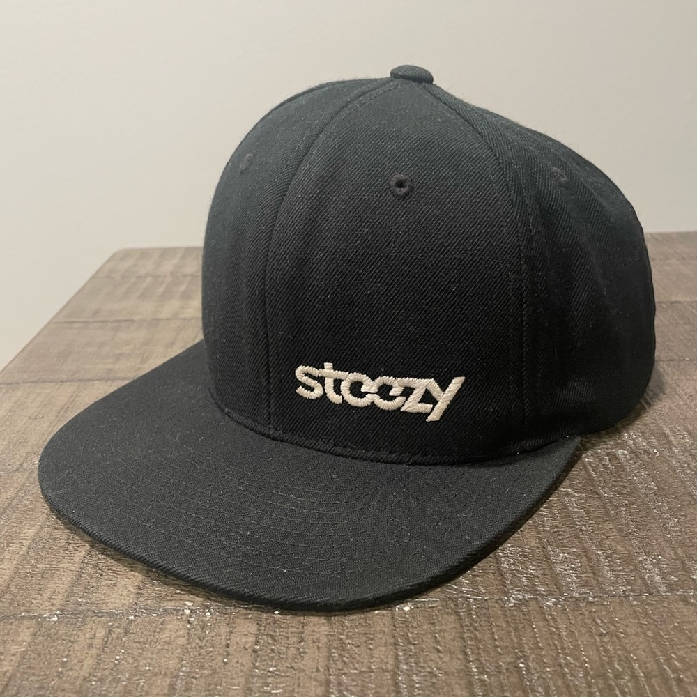 Steezy Black hat, flat brim and adjustable snap back by The Classics of Yupoong